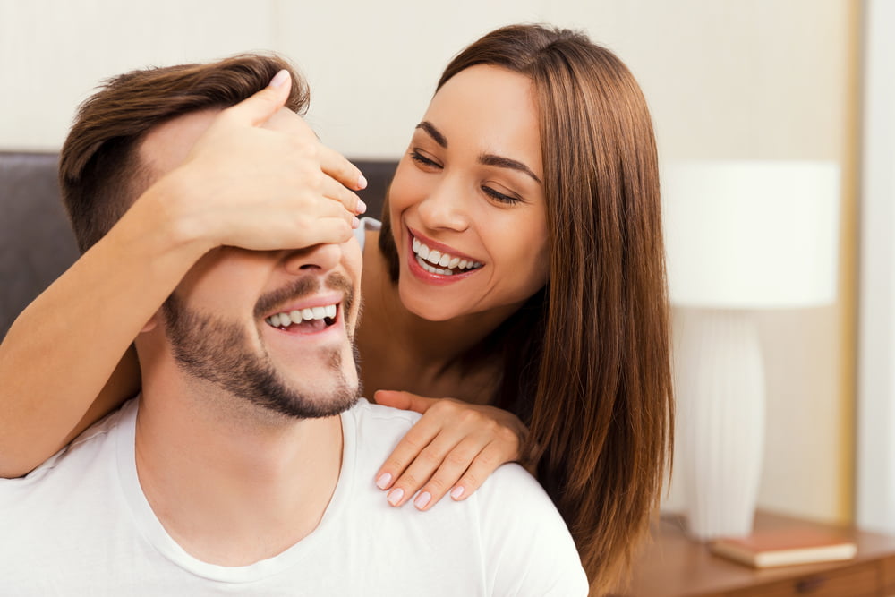 A couple playfully bonding - Cosmetic Dentistry in Atlanta, GA