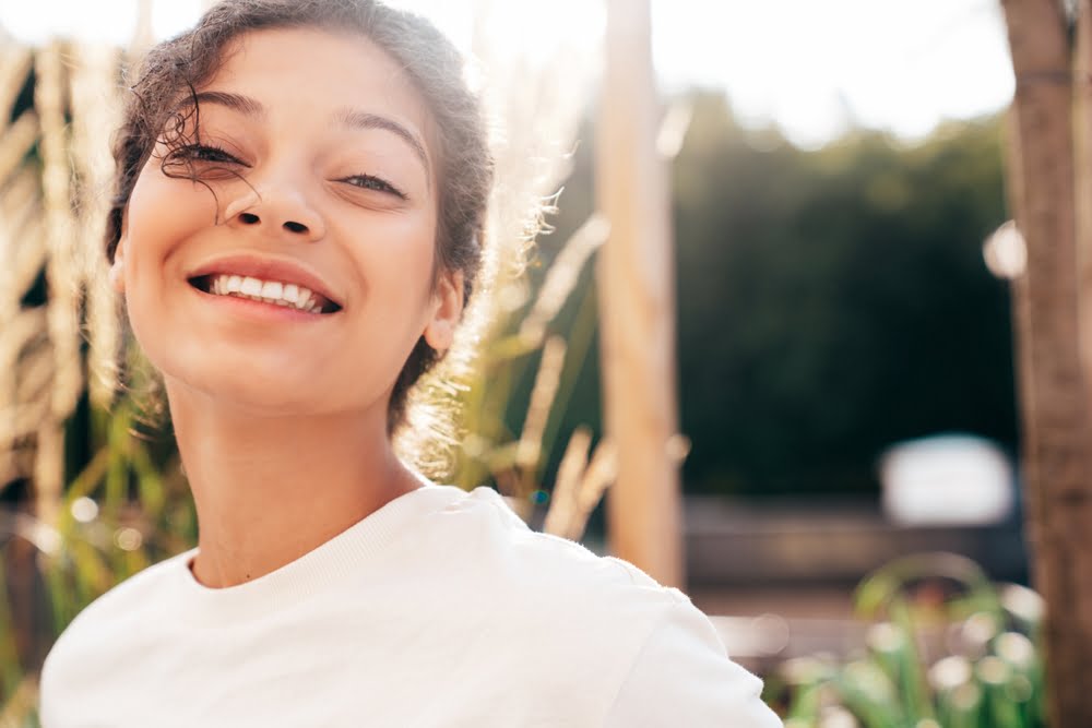A carefree woman outdoors - Cosmetic Dentistry in Atlanta, GA