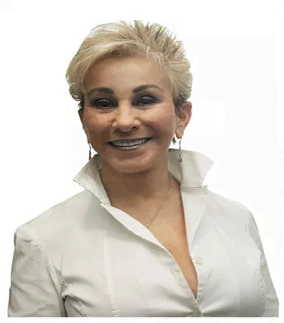 A woman smiling in a white collared shirt - Dentist Atlanta A woman smiling in a white collared shirt - Dentist Atlanta
